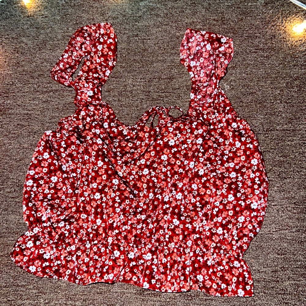 This is a 2 piece. Tank top and skirt. This is a red skirt and top with flowers.